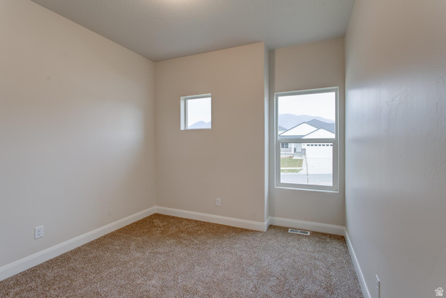 1512 West 600 North, Unit O4A Mapleton, UT 84664 - Photo 17 of 24 Empty room featuring light colored carpet and baseboards