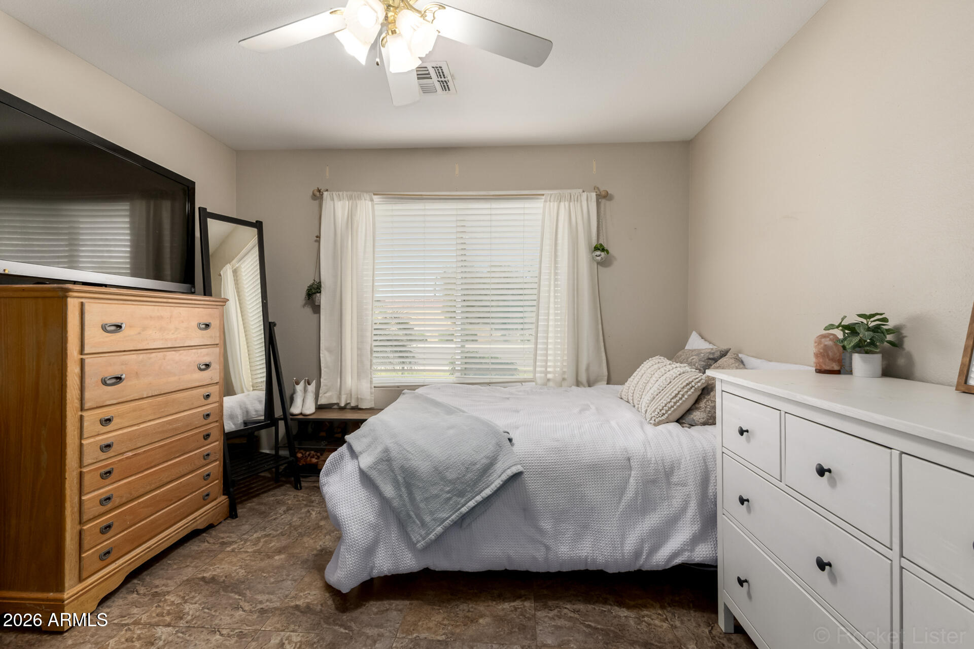 9545 East Inverness Circle Mesa, AZ 85209 - Photo 14 of 26 a bedroom with a bed and a flat screen tv
