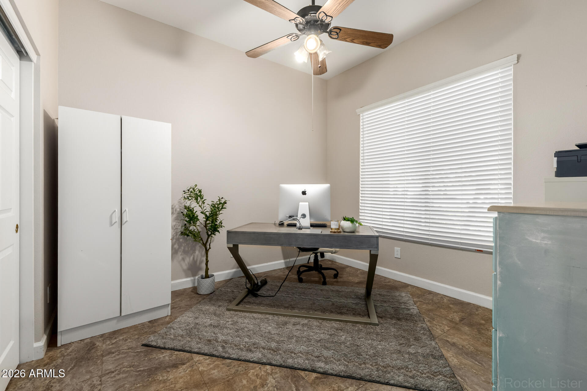 9545 East Inverness Circle Mesa, AZ 85209 - Photo 15 of 26 a view of a workspace with furniture and a window