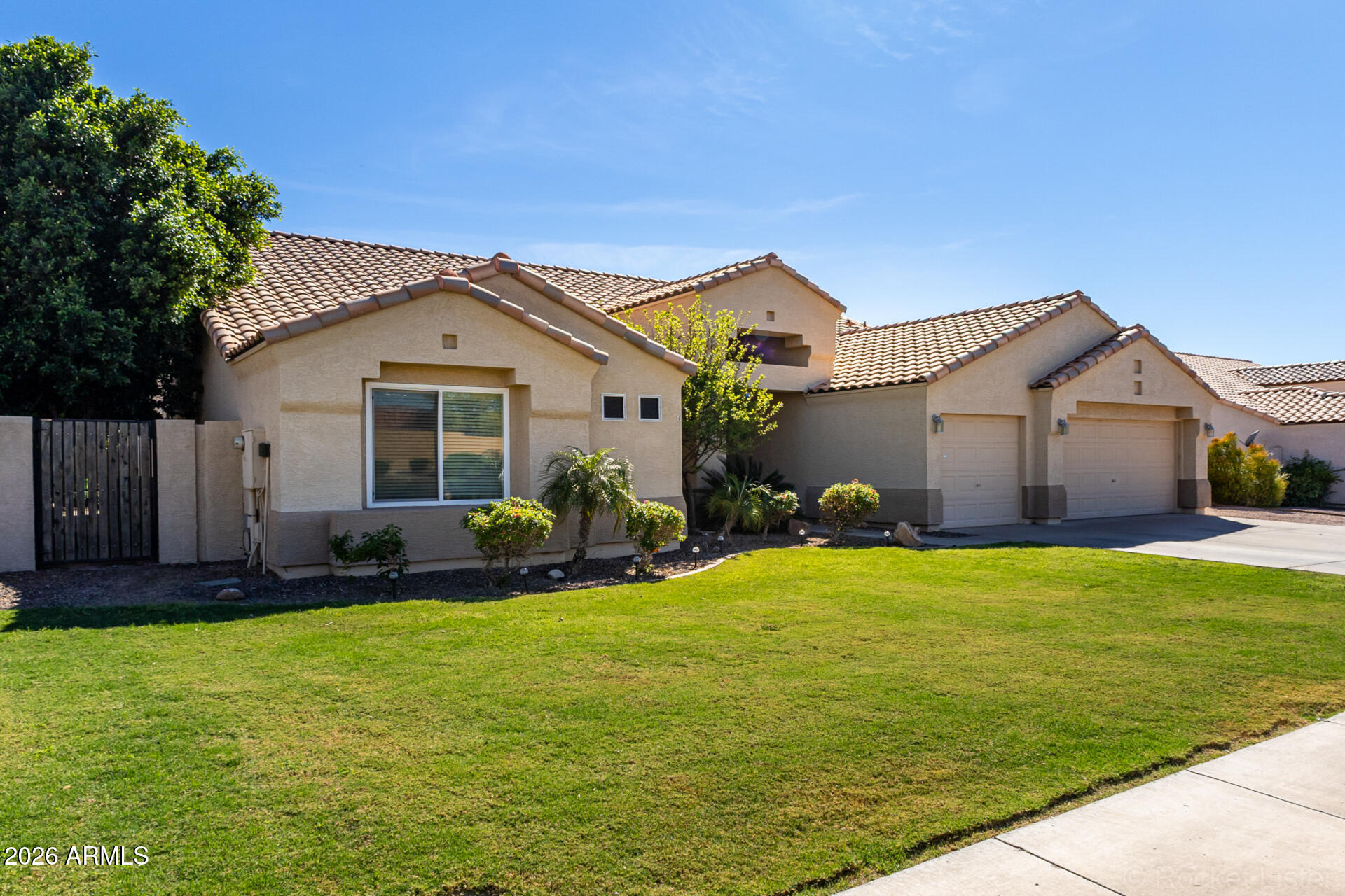 9545 East Inverness Circle Mesa, AZ 85209 - Photo 2 of 26 a front view of a house with a yard