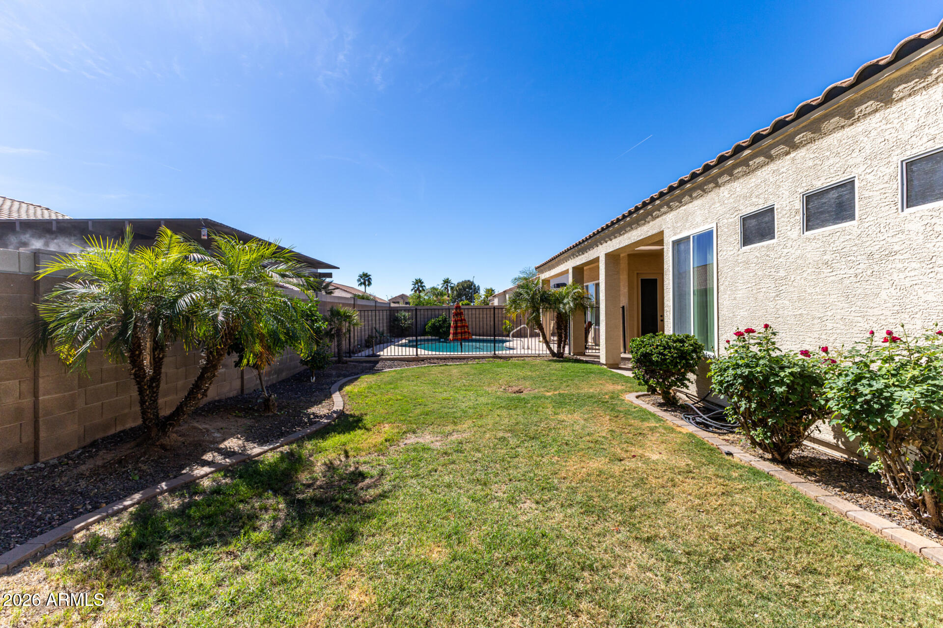 9545 East Inverness Circle Mesa, AZ 85209 - Photo 23 of 26 a view of swimming pool with a patio