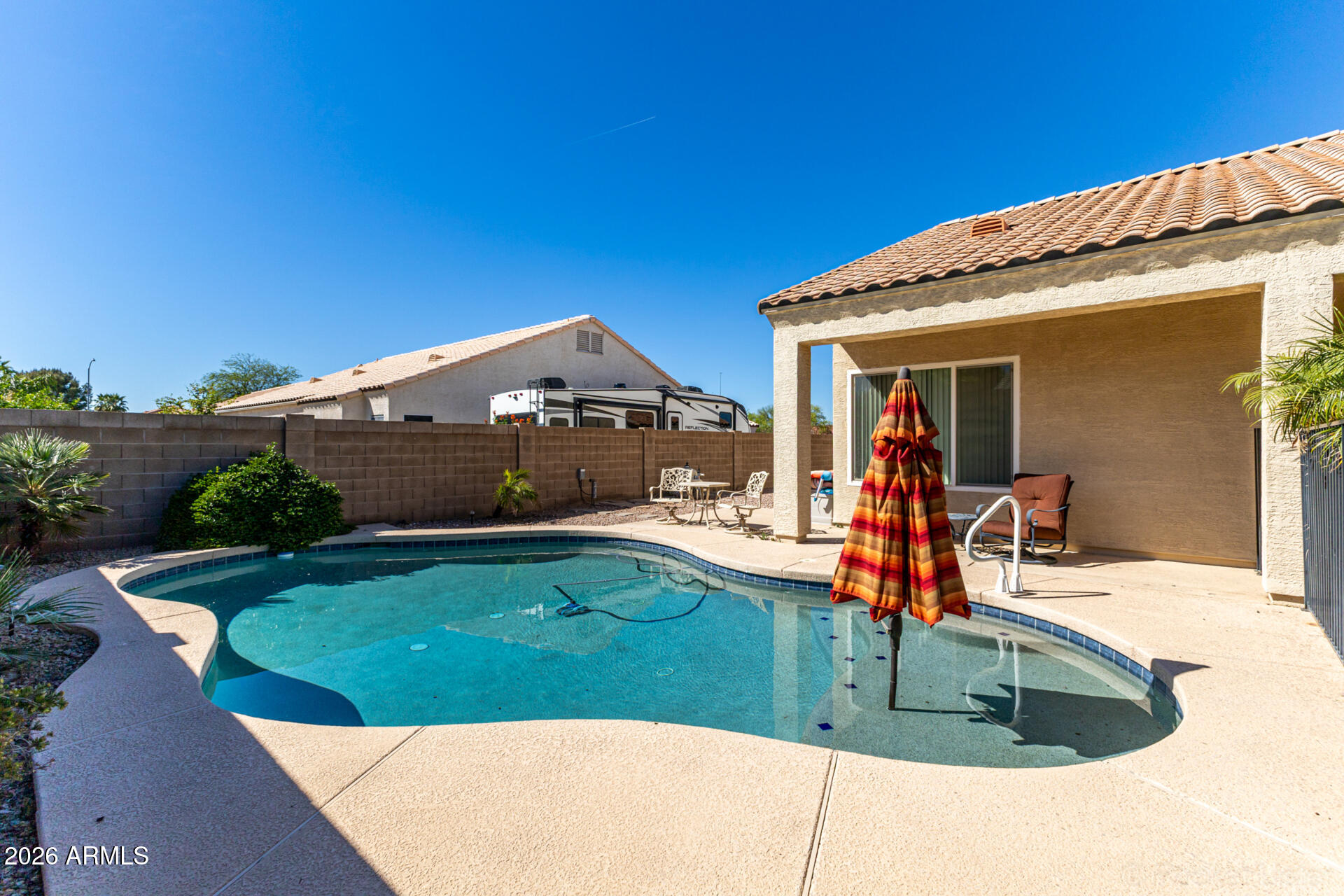 9545 East Inverness Circle Mesa, AZ 85209 - Photo 25 of 26 a view of a house with a swimming pool
