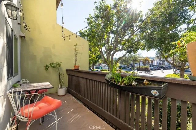 a view of a balcony with chairs