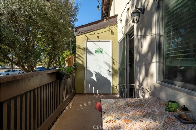 a view of a brick house with a small yard