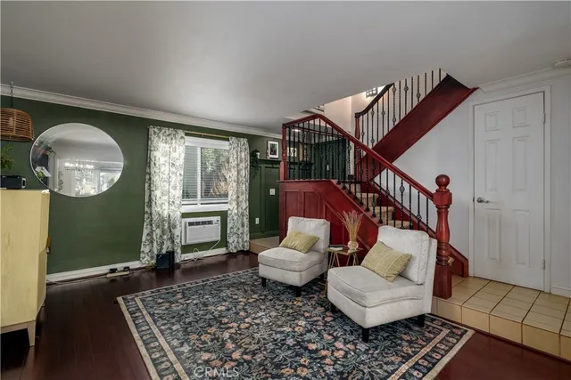 a living room with furniture and a rug