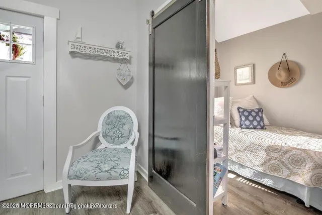 a bedroom with a bed and a table in it