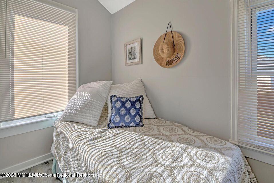 604 1/2 12th Avenue, Unit BACK HOUSE Belmar, NJ 07719 - Photo 14 of 19 a bedroom with a bed and a window