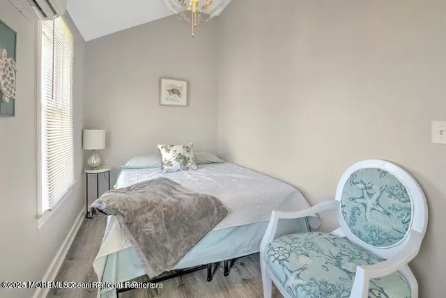 a bedroom with a bed and a table in it