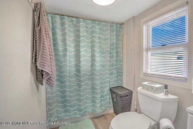 a bathroom with a toilet and a sink