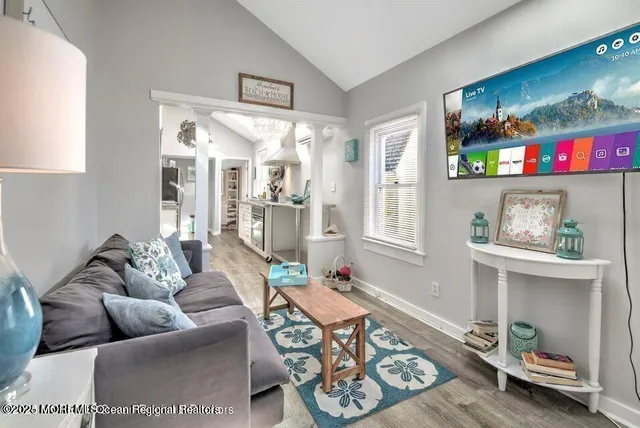 a living room with furniture and a table