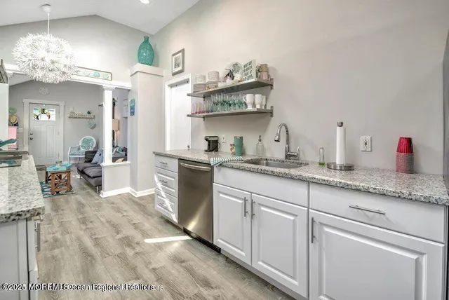 a kitchen with cabinets and window