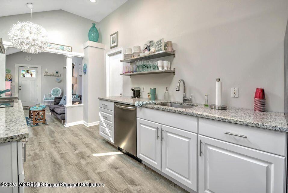 604 1/2 12th Avenue, Unit BACK HOUSE Belmar, NJ 07719 - Photo 7 of 19 a kitchen with cabinets and window