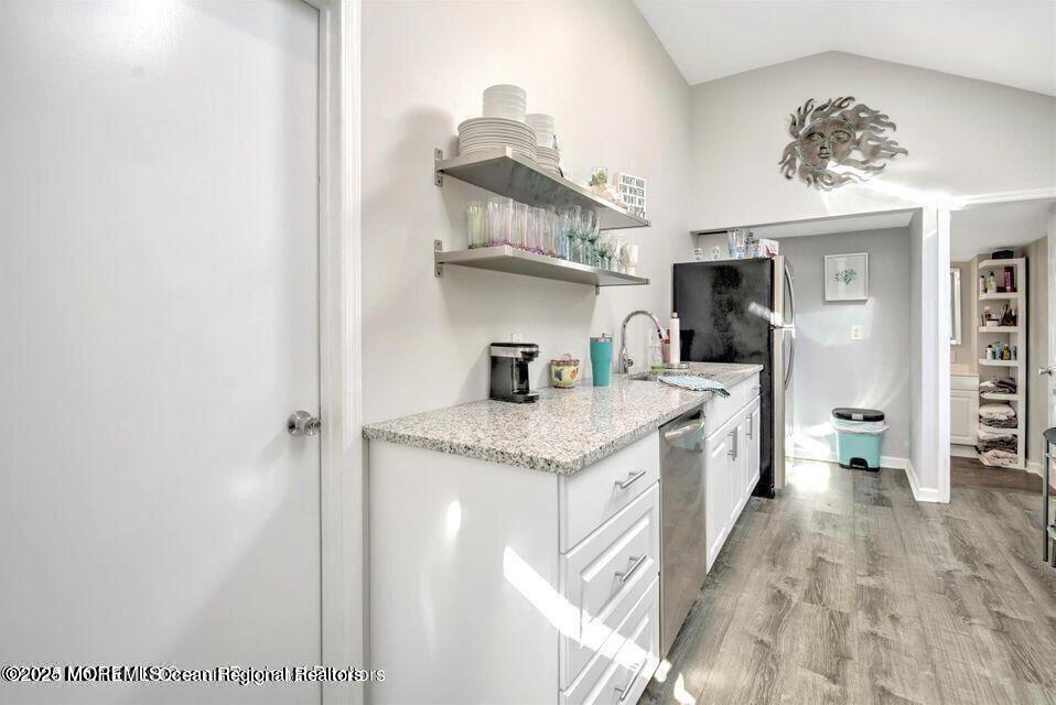 604 1/2 12th Avenue, Unit BACK HOUSE Belmar, NJ 07719 - Photo 10 of 19 a kitchen with stainless steel appliances granite countertop a sink and cabinets