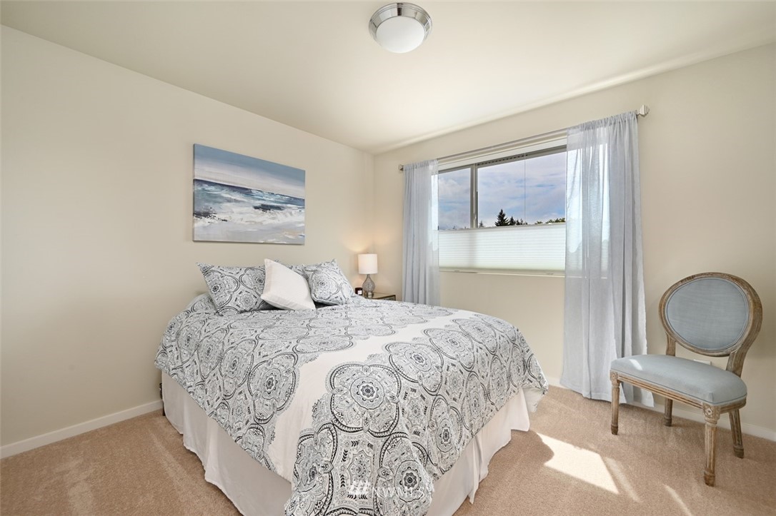 1500 South 28th Street Renton, WA 98055 - Photo 20 of 29 a bedroom with a bed and a painting on the wall