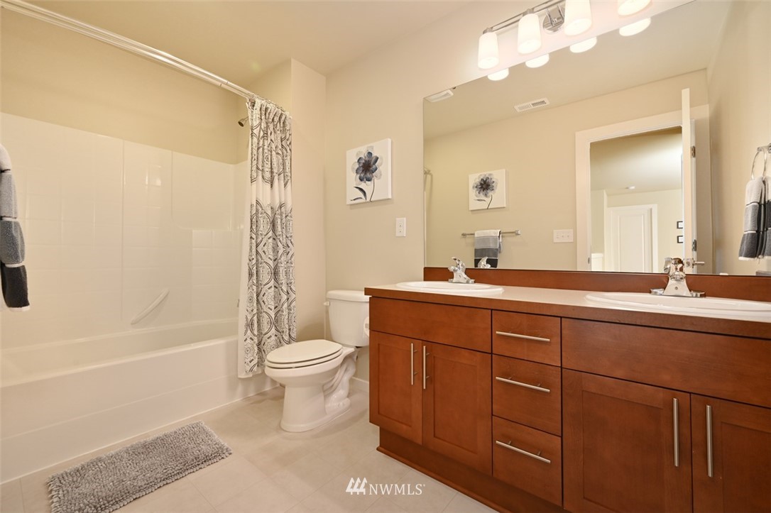 1500 South 28th Street Renton, WA 98055 - Photo 22 of 29 a bathroom with a sink a toilet and shower