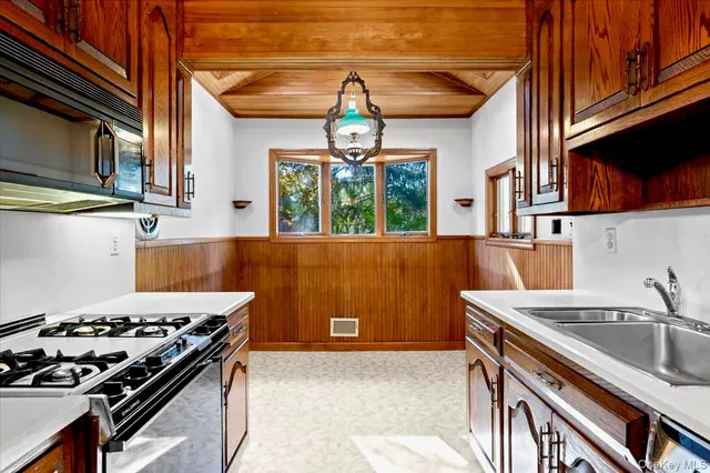 a kitchen with a stove and a sink