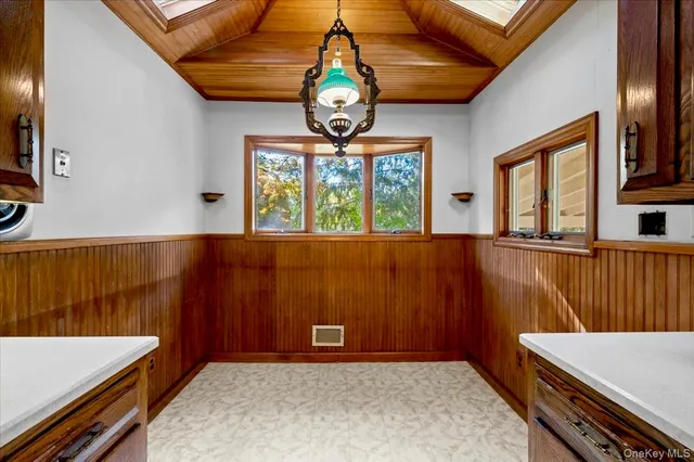 a view of a room with furniture and windows