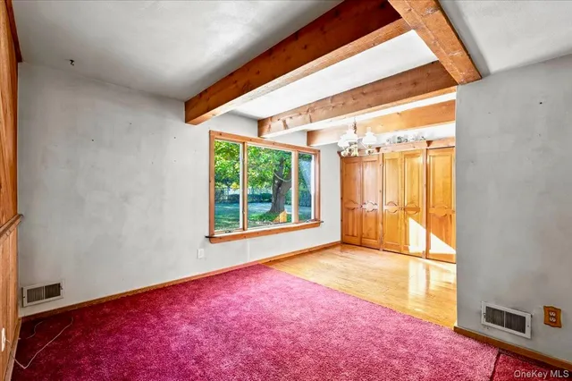 a view of a room with a large window