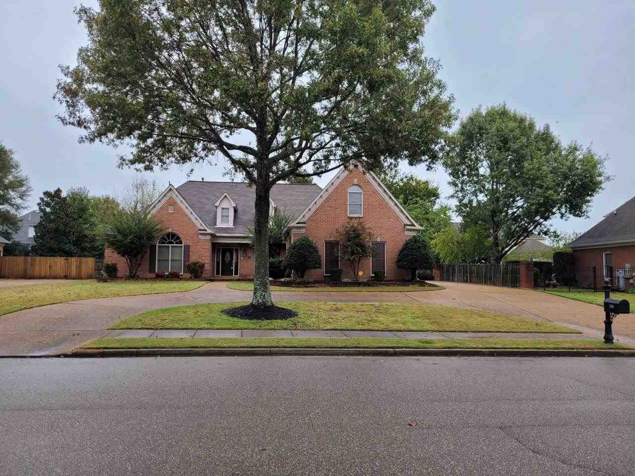 536 Estanaula Road Collierville, TN 38017 - Photo 1 of 25 a front view of a house with a yard and trees