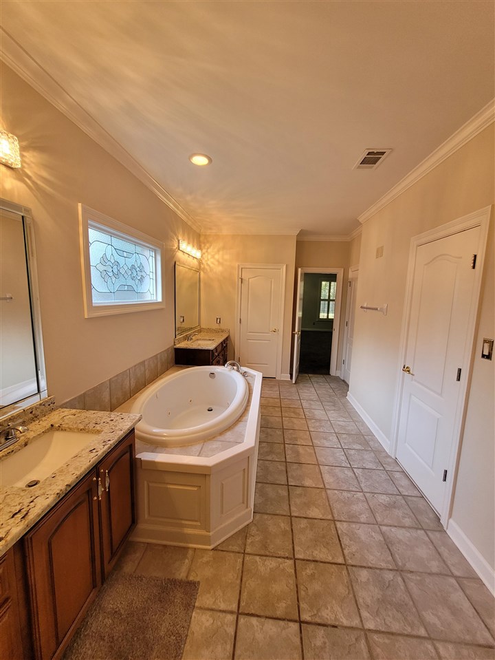 536 Estanaula Road Collierville, TN 38017 - Photo 17 of 25 a bathroom with a sink a toilet and a shower