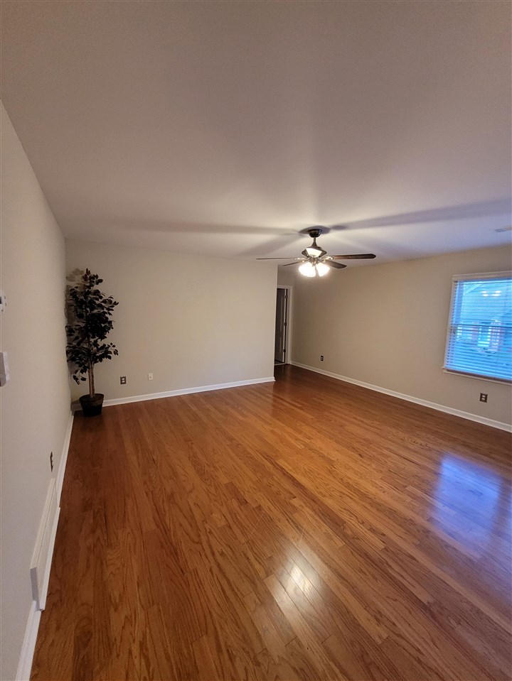 536 Estanaula Road Collierville, TN 38017 - Photo 19 of 25 wooden floor in an empty room with a window