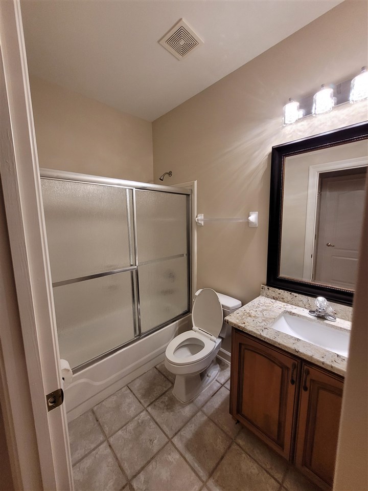 536 Estanaula Road Collierville, TN 38017 - Photo 22 of 25 a bathroom with a granite countertop sink toilet and shower