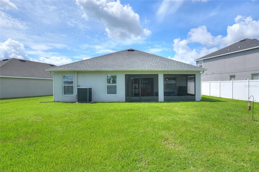 6360 Gardner Road Lakeland, FL 33813 - Photo 37 of 47 a view of a house with a garden