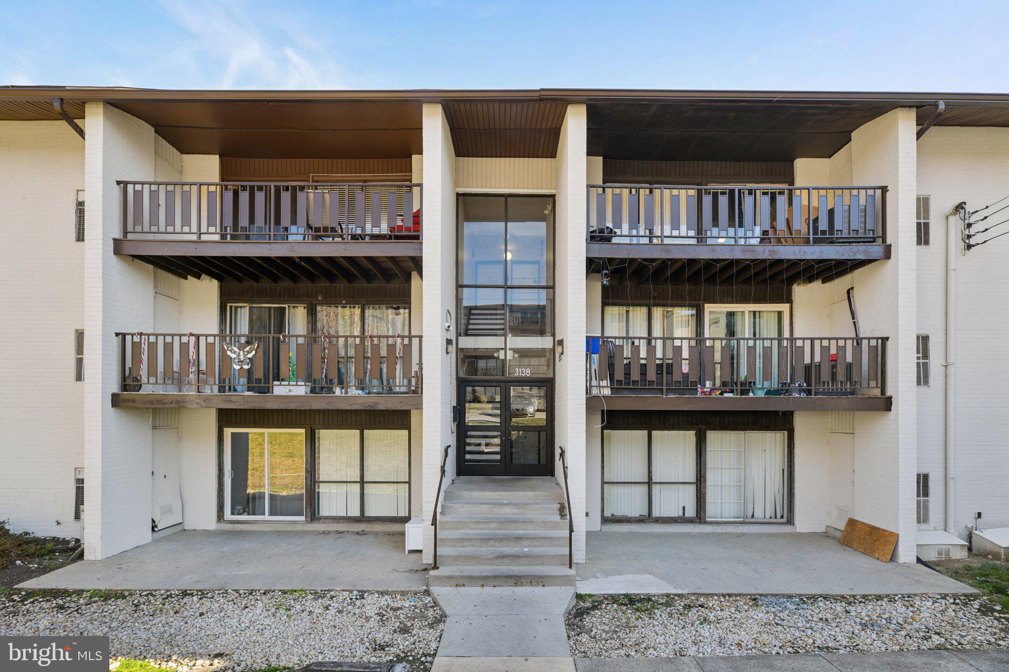 3138 Brinkley Road, Unit 8102 Temple Hills, MD 20748 - Photo 1 of 27 a view of a living room and bathroom with furniture