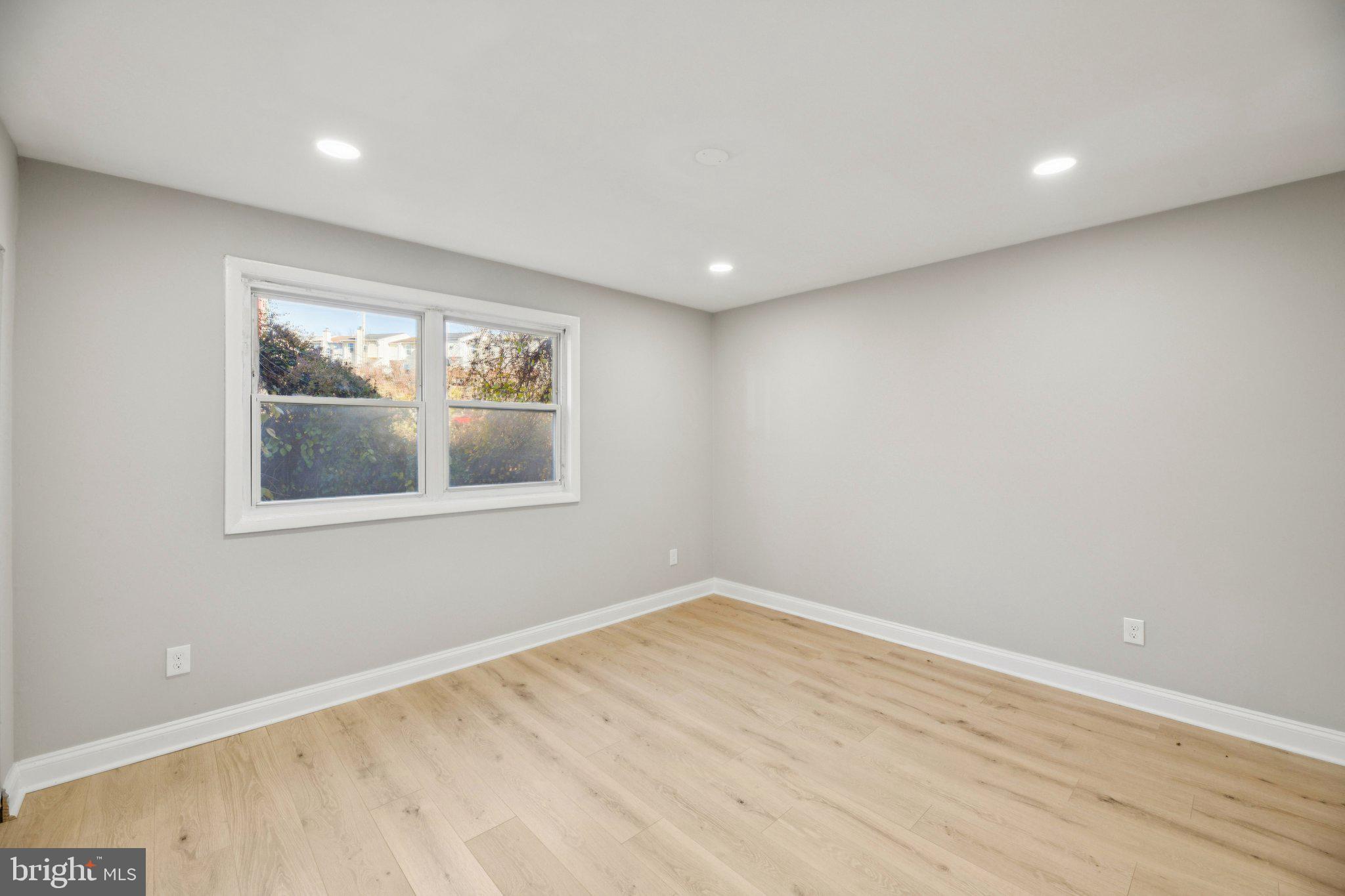 3138 Brinkley Road, Unit 8102 Temple Hills, MD 20748 - Photo 17 of 27 a view of empty room with wooden floor and fan