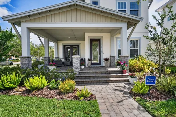 a view of a house with potted plants