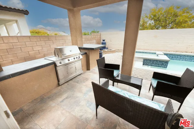 a kitchen with a table chairs and a stove