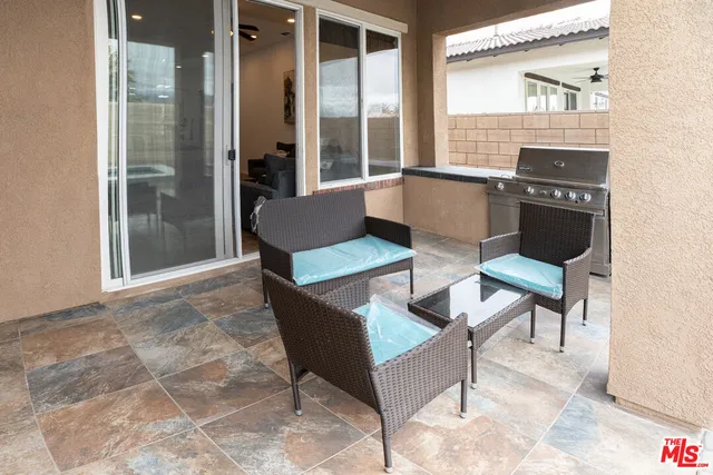a living room with fireplace furniture and a table