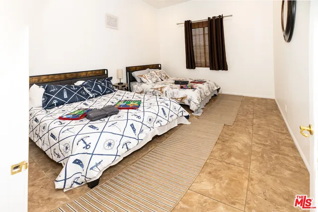 a bedroom with bed and walk in closet