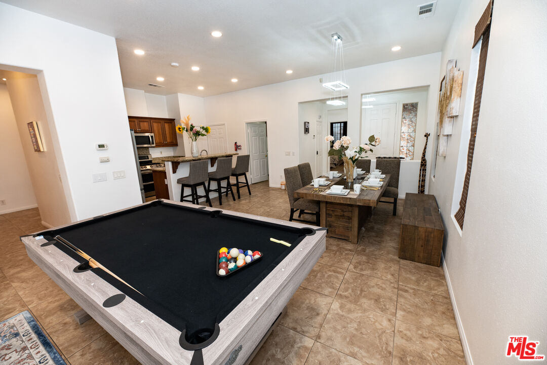84226 Canzone Drive Indio, CA 92203 - Photo 6 of 23 a living room with furniture and a table