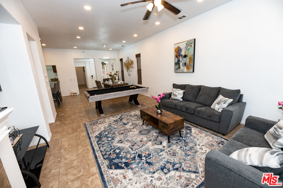 84226 Canzone Drive Indio, CA 92203 - Photo 7 of 23 a living room with furniture and a rug