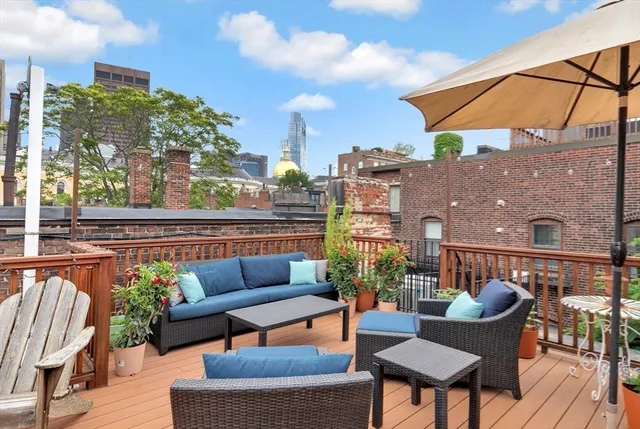 a balcony with furniture and city view