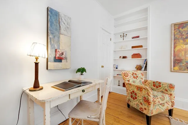 a living room with table and furniture