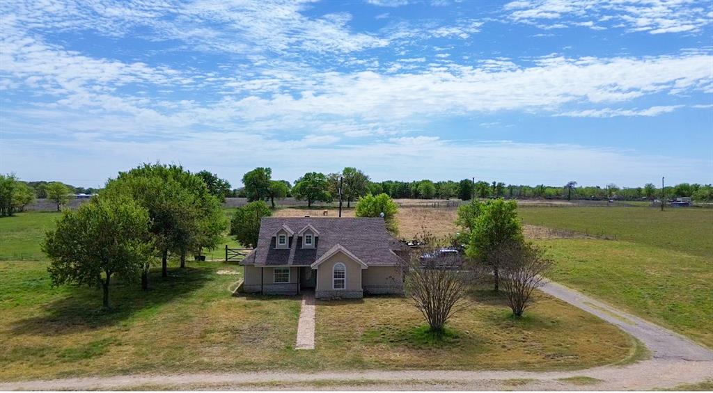 4773 Patton Lake Road Aquilla, TX 76622 - Photo 1 of 25 a view of a lake with a house in the background