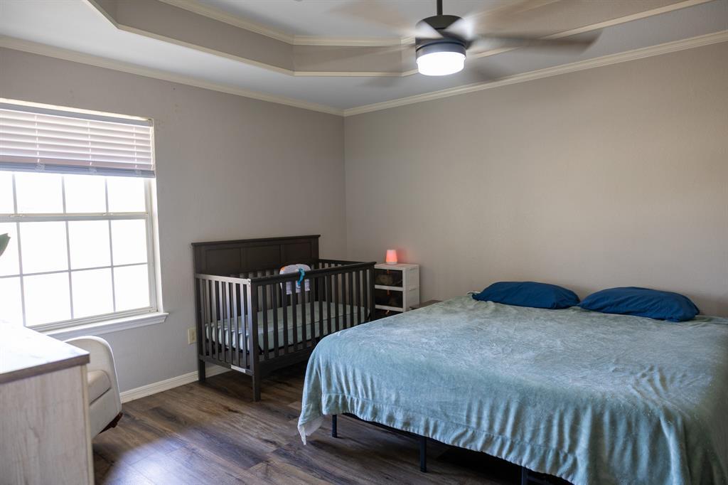 4773 Patton Lake Road Aquilla, TX 76622 - Photo 11 of 25 a bedroom with a bed and a window