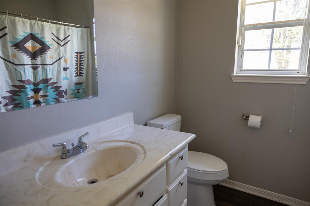 4773 Patton Lake Road Aquilla, TX 76622 - Photo 18 of 25 a bathroom with a sink and a toilet