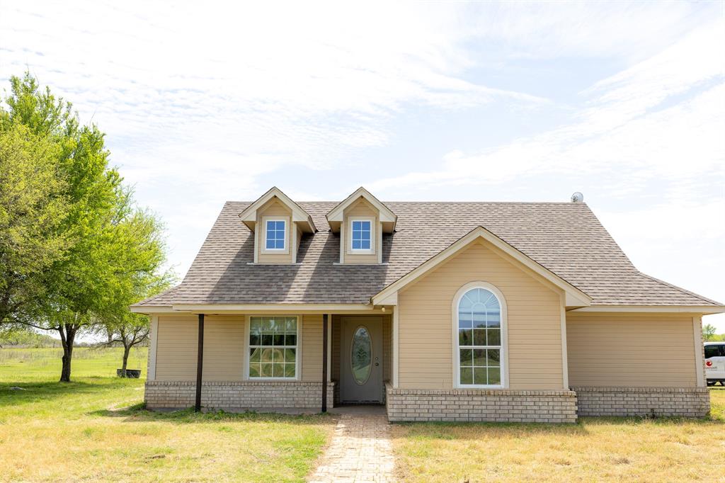 4773 Patton Lake Road Aquilla, TX 76622 - Photo 2 of 25 a front view of a house with a yard