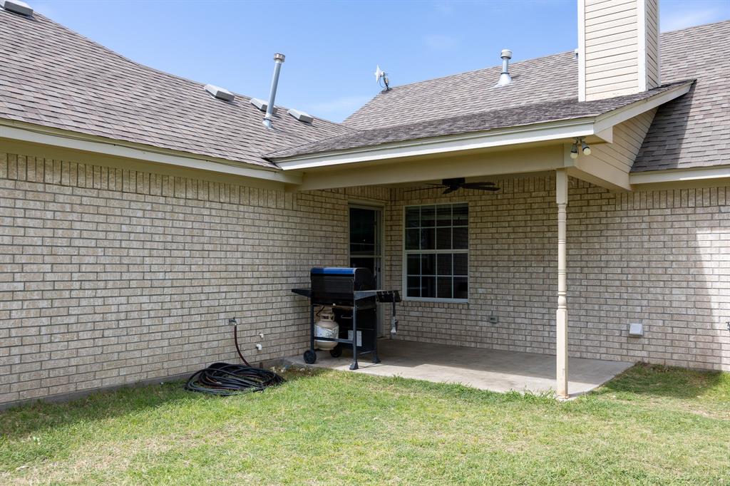 4773 Patton Lake Road Aquilla, TX 76622 - Photo 22 of 25 a front view of a house with a yard
