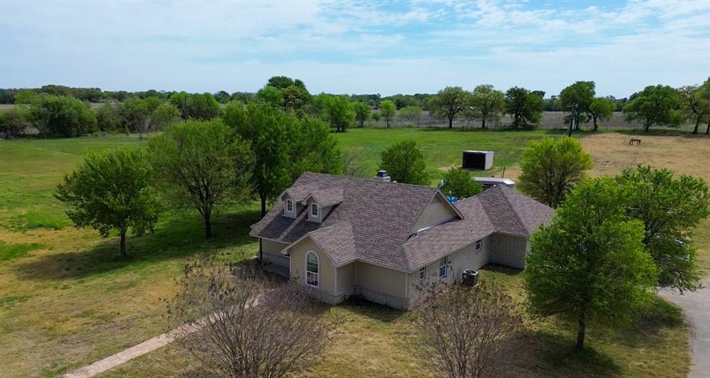 4773 Patton Lake Road Aquilla, TX 76622 - Photo 25 of 25 a view of a garden with lawn chairs and a yard