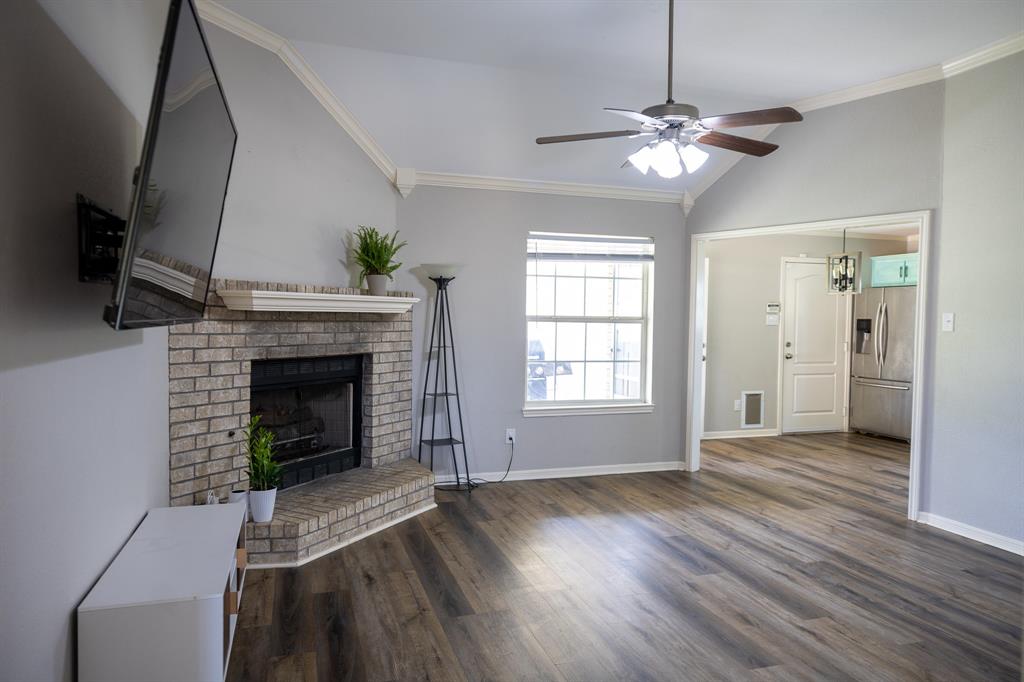 4773 Patton Lake Road Aquilla, TX 76622 - Photo 4 of 25 a view of empty room with fireplace and wooden floor