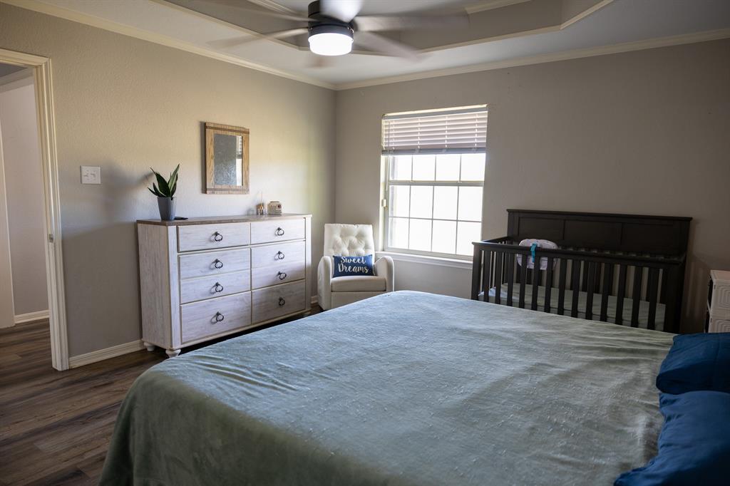 4773 Patton Lake Road Aquilla, TX 76622 - Photo 10 of 25 a bedroom with a bed and a window