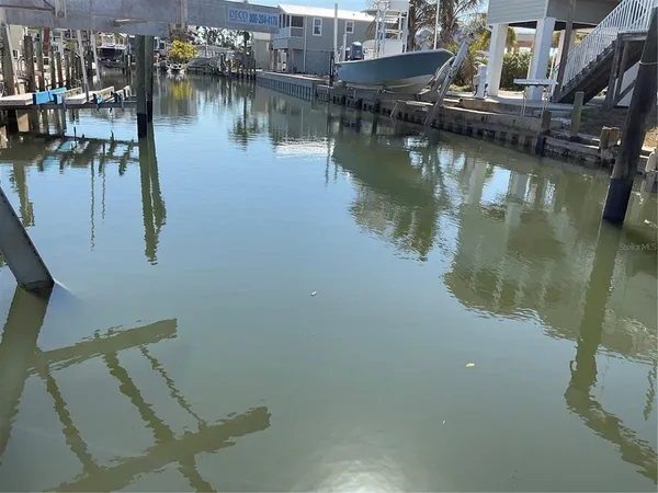 a view of water pond with boats