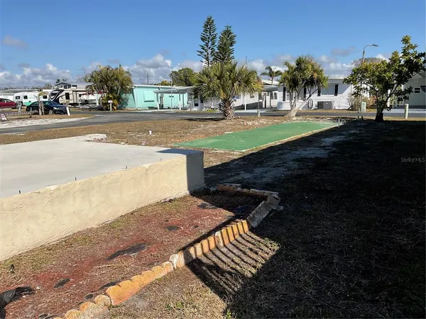 a view of a yard and street view