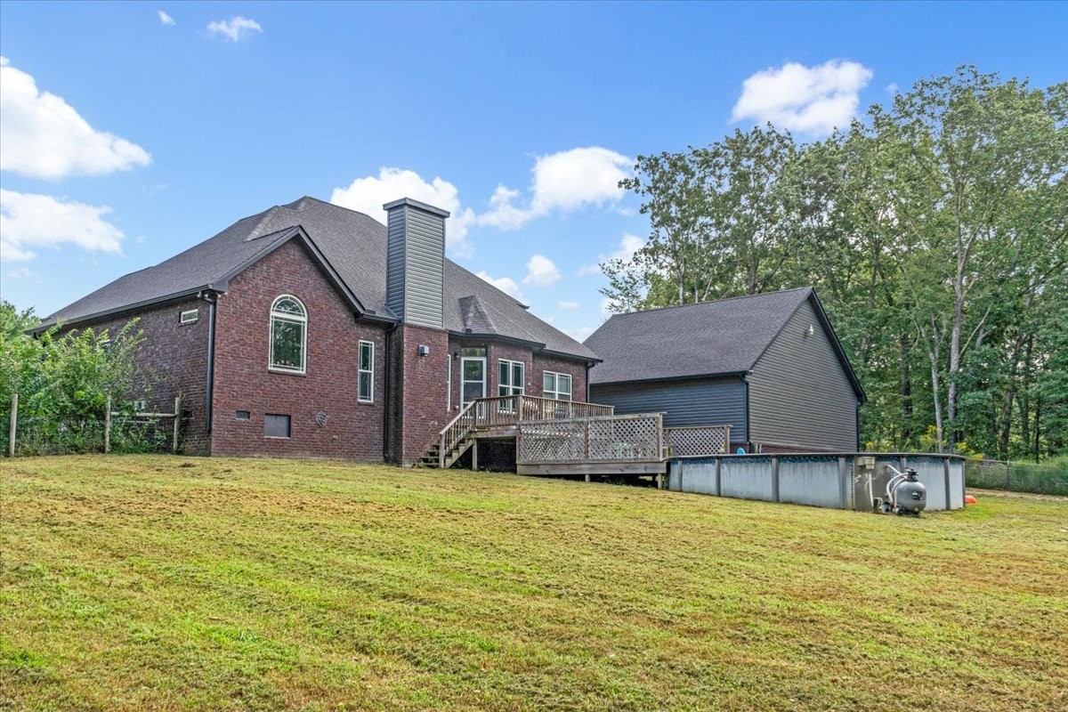 240 Taylor Road Manchester, TN 37355 - Photo 8 of 39 a view of a house with a yard and a large tree
