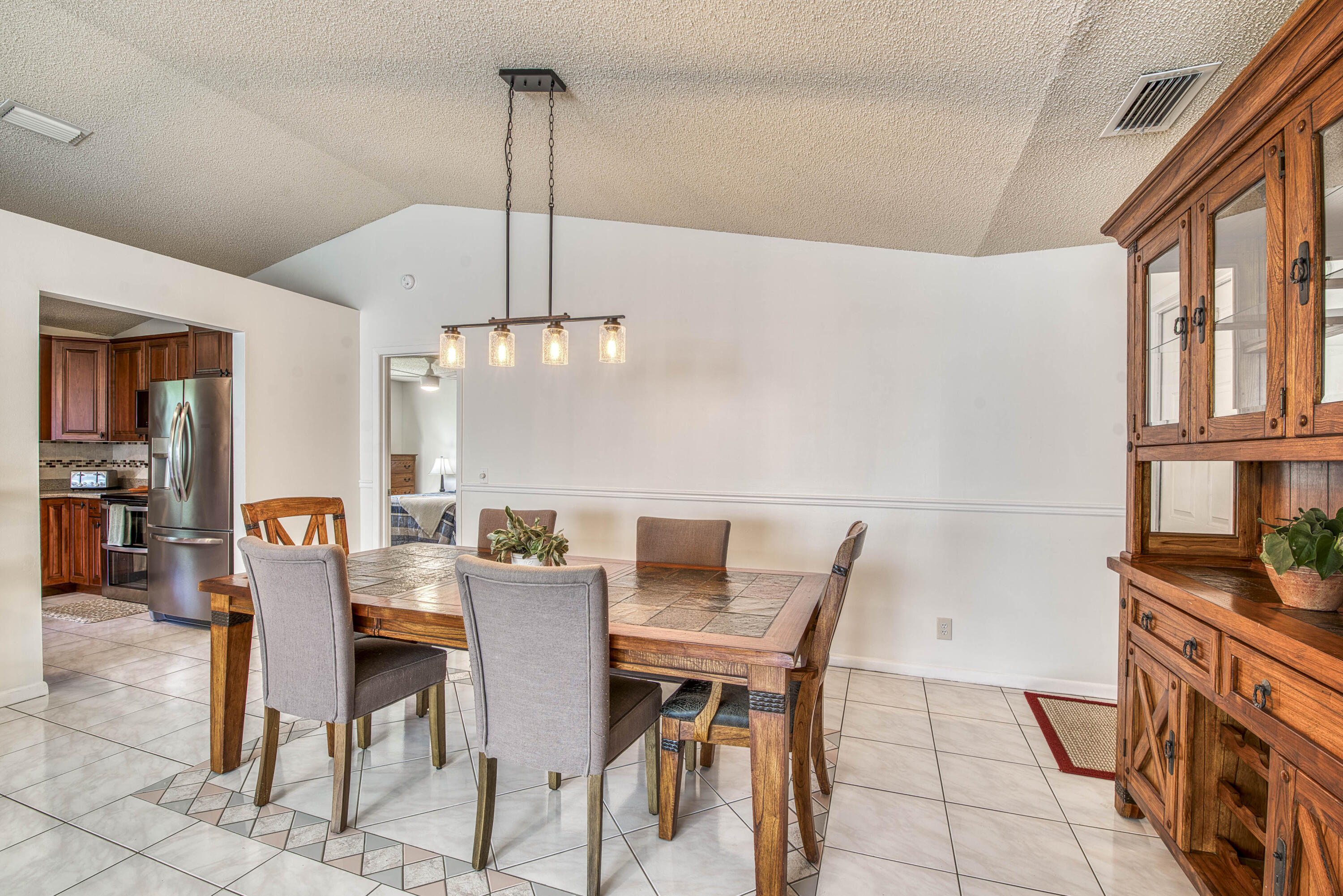 6690 Southeast Raintree Avenue Stuart, FL 34997 - Photo 11 of 43 a view of a dining room with furniture