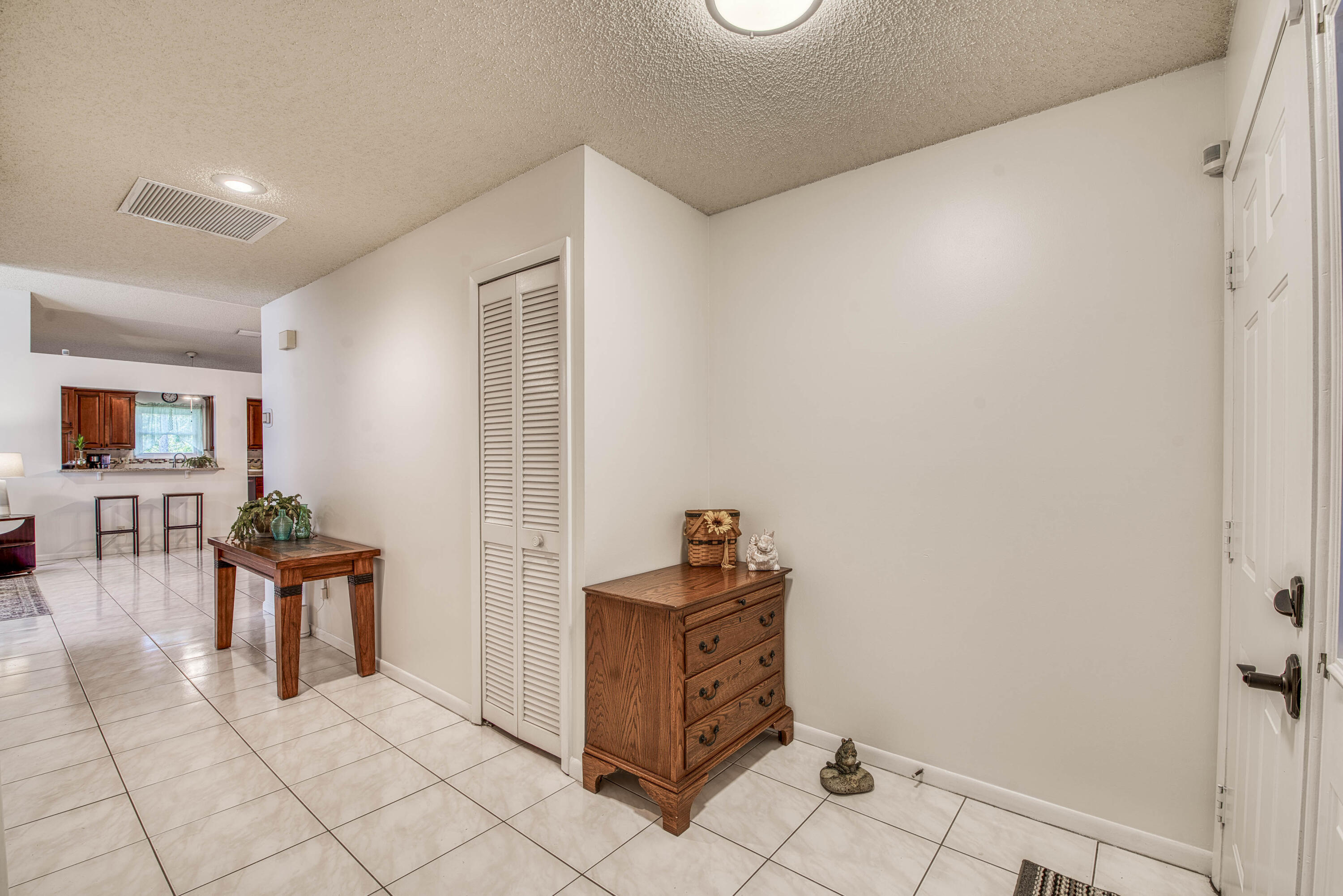 6690 Southeast Raintree Avenue Stuart, FL 34997 - Photo 21 of 43 a view of a hallway with seating area